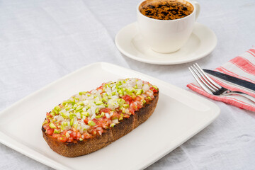 Spread salad on a slice of toasted bread. Whole wheat bread slice with salad. Healthy vegetable appetizer.