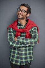 Handsome man in plaid shirt isolated on gray background