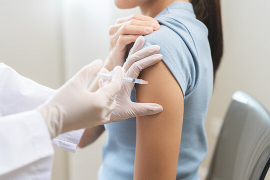 Health care, corona virus, hand of woman nurse, doctor giving syringe vaccine, injection dose on arm sick patient at clinic. Vaccination, immunization disease prevention against flu pandemic influenza