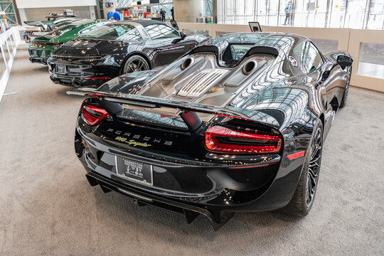 New York City, USA - March 27, 2024: 2015 Porsche 918 Spyder. Luxury Porsche 918 Spyder. Modern Porsche 918 Spyder sportscar at New York International Auto Show, back angle view