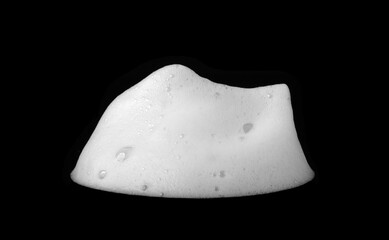 Liquid white foam from soap or shampoo or bath bubbles. Abstract soap bubbles. Soap bubbles set. Soap bubbles isolated on black with texture and contrast background.