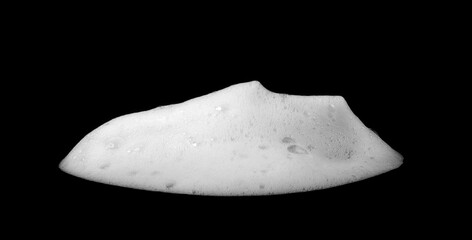 Liquid white foam from soap or shampoo or bath bubbles. Abstract soap bubbles. Soap bubbles set. Soap bubbles isolated on black with texture and contrast background.