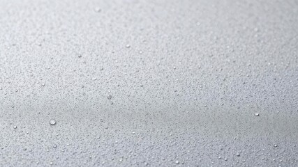 Obraz premium Close-up of water-drop texture on a surface, reflective