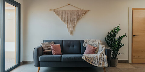 Cozy living room with modern sofa and decorative wall hanging in contemporary space