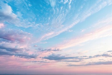 Fototapeta premium pale pink and blue hues in a gradient-like effect in the sky, peaceful atmosphere, pastel colors