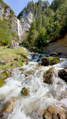 dalfazer waterfall during Spring time with deep blue background sky