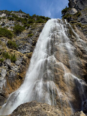 Obraz premium dalfazer waterfall during Spring time with deep blue background sky