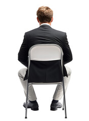 Professional man seated on a folding chair in business attire facing away against a white background