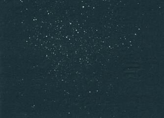 Grunge white ink splatter on dark background. Artistic distressed layout backdrop. For art poster layout.