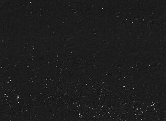 Grunge black background with white stain splatter. Abstract distressed backdrop design.