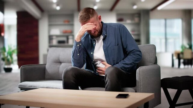 Man With Heartburn And Nausea