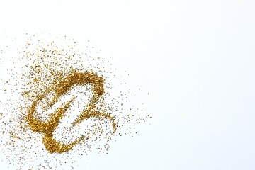 Beautiful golden confetti on a white background