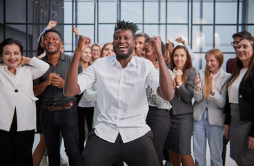 Obraz premium Composition of business executives or partners raised their hands up