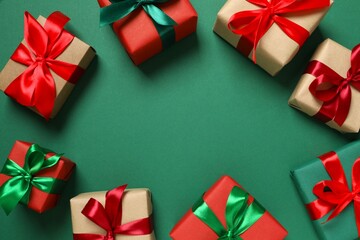 Beautiful gift boxes tied with bows on color background 
