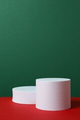 White podiums on color background 