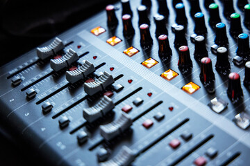 Closeup new blue knob for music mixers. sound engineer music mixer control panel.
