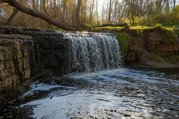 View of Sablinskiy Waterfall on a sunny October day. Ulyanovka. Leningrad Region, Russia