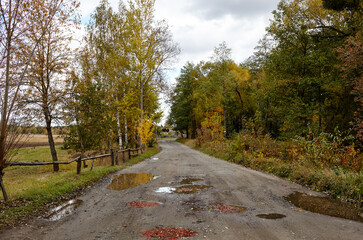 A gravel road at rural Europe. Suburban road path