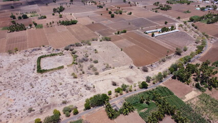 Obraz premium Drone photography showcasing the beauty of red soil landscapes #redsoil land #dronephoto #landscapeview