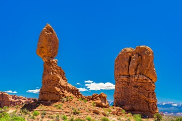 Stunning red rock formations under a sunny sky at Arches National Park, Utah
