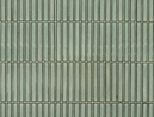 Celadon green or pale green subway tiles seamless background texture. Subway tiles are often used in bathrooms or commercial places for its unique brick style pattern.