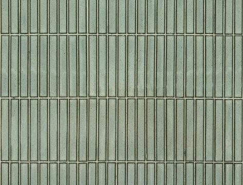 Celadon green or pale green subway tiles seamless background texture. Subway tiles are often used in bathrooms or commercial places for its unique brick style pattern.