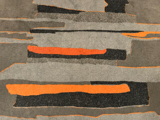 Random customized rug in shades of orange, red, grey, and black color. Vibrant and edgy carpet...