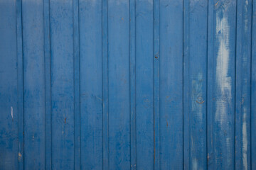 Background of wooden vertical lines planks in bright blue wood