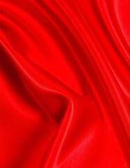Obraz premium red shiny silk fabric folded texture