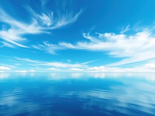 Obraz premium A serene pond reflects the vibrant blue sky with a few wispy clouds scattered across it creating a sense of tranquility and peacefulness, blue, water, serene