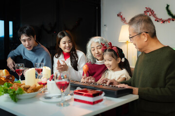 Dinner and Family holiday celebrating, together at Merry Christmas and  New Year. in a cozy festive home setting.