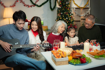 Dinner and Family holiday celebrating, together at Merry Christmas and  New Year. in a cozy festive home setting.