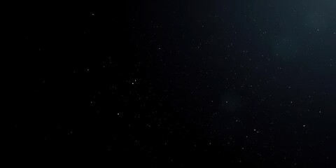 Obraz premium Tiny specks of dust fall from the sky onto a black background, light scattering, dark sky, dust on black