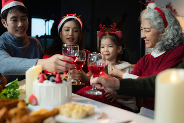 Dinner and Family holiday celebrating, together at Merry Christmas and  New Year. in a cozy festive home setting.