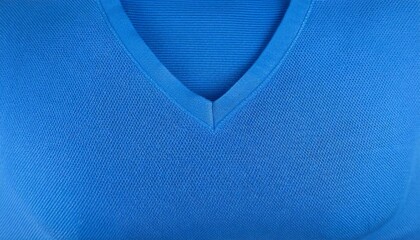 Detailed shot of a textured blue v neck sweater, perfect for fashion and textile design projects