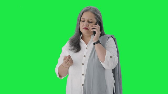 Indian mother talking on phone Green screen