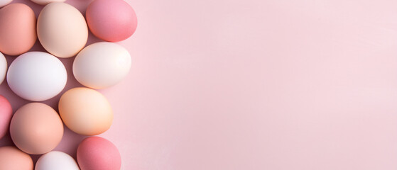 Fototapeta premium A minimalistic pink background with scattered eggs, offering elegant copyspace for versatile designs.