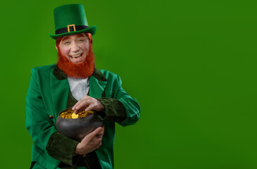 Leprechaun elf on St. Patrick's Day. Cheerful character Irish leprechaun for advertising with a red...