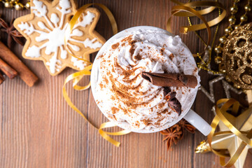 Hot chocolate, latte coffee or eggnog cocktail with whipped crea