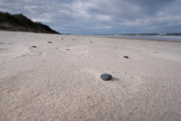 SEA COAST - A beautiful wide beach under a picturesquely cloudy sky
