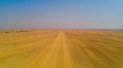 A tranquil desert landscape with golden sand dunes stretching to the horizon.