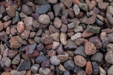 Close-up of small stones as nature background. Copy space. Stones on railway embankment