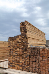 Wooden planks. Beams. Air-drying timber stack. Wood air drying (seasoning lumber or wood seasoning). Timber. Lumber.