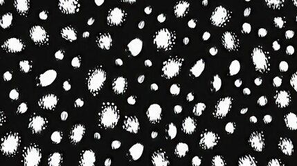 Abstract black and white pattern featuring random dots and splashes.