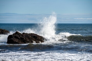Waves crashing on rocky shore