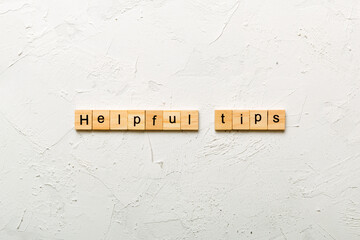 helpful tips word written on wood block. helpful tips text on table, concept