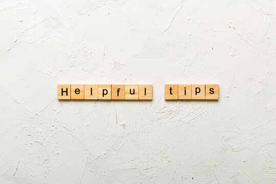 helpful tips word written on wood block. helpful tips text on table, concept