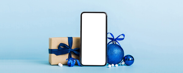 Digital phone mock up with rustic Christmas decorations for app presentation with empty space for...