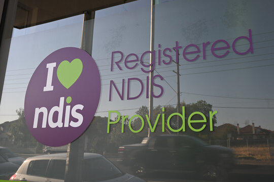 I heart NDIS sign in the window of a registered National Disability Insurance Scheme provider's service location