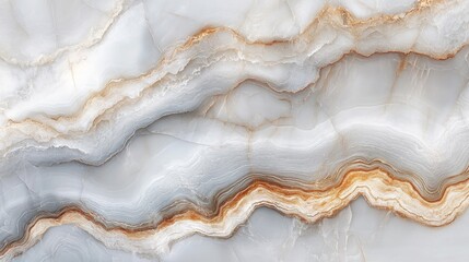 Obraz premium Close-up of elegant light grey and beige marble texture with wavy patterns and veins.